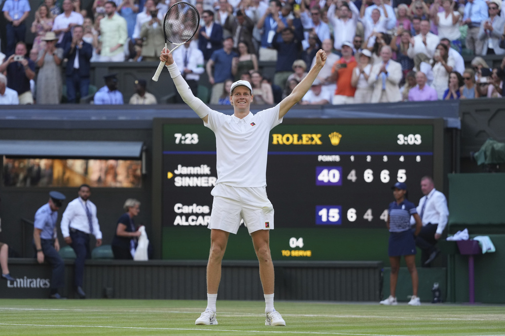 Jannik Sinner of Italy celebrates after winning the men's singles final match against Carlos Alcaraz of Spain at the Wimbledon Tennis Championships in London.