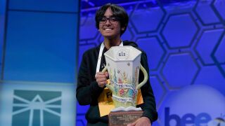 Faizan Zaki, 13, of Dallas, holds the trophy after winning the 2025 Scripps National Spelling Bee at the Gaylord National Resort & Convention Center Thursday, May 29, 2025, in Oxon Hill, Md. 