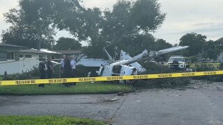 Crews remained at the scene on July 24, 2025, a day after four people were hospitalized with minor injuries after a small plane crash in a Pembroke Pines neighborhood.